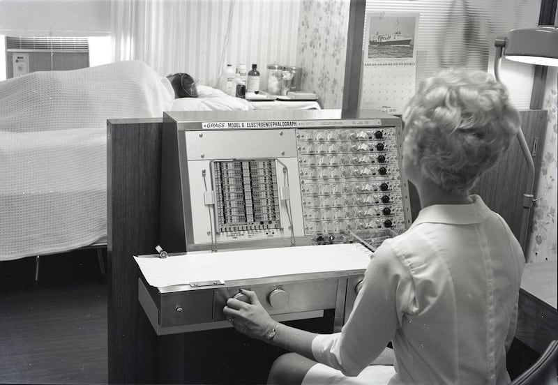 The DeKalb Public Hospital's new electroencephalograph is demonstrated by Mrs. Glennie Barshinger in 1970.