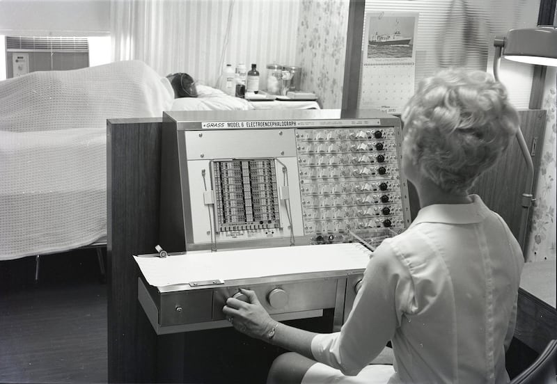 The DeKalb Public Hospital's new electroencephalograph is demonstrated by Mrs. Glennie Barshinger in 1970.