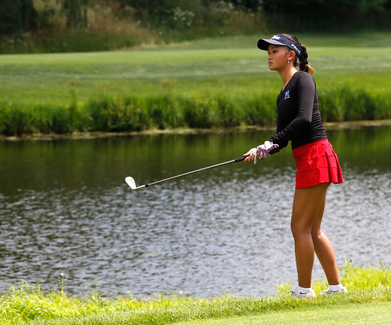 Jordan Cheng watches her approach shot on the fifth hole during the final round of McHenry County Junior Amateur Golf Tournament on Tuesday, July 18, 2025, at Foxford Hills Golf Club in Cary.