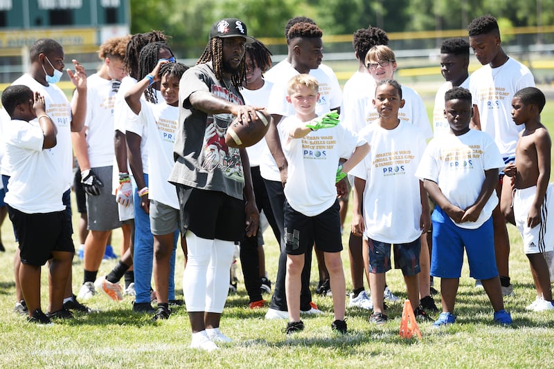 Pittsburgh Steelers running back and Kankakee native Jonathan Ward, gray shirt, gives instructions to campers at his third annual Skills Camp at Bishop McNamara, Ward's alma mater, in June 2022.