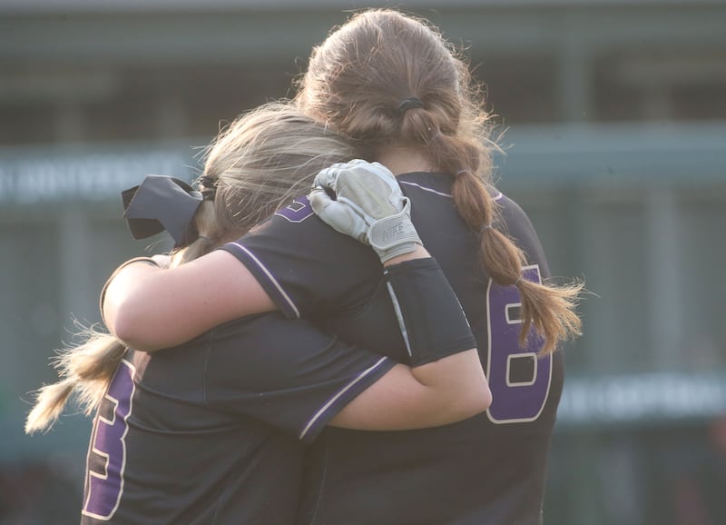 Serena's Maddie Glade (6) hugs younger sister Brynley Glade (13) after the Huskers' 9-5 loss to LeRoy in the Class 1A Illinois Wesleyan Supersectional on Monday, June 2, 2025, in Bloomington.