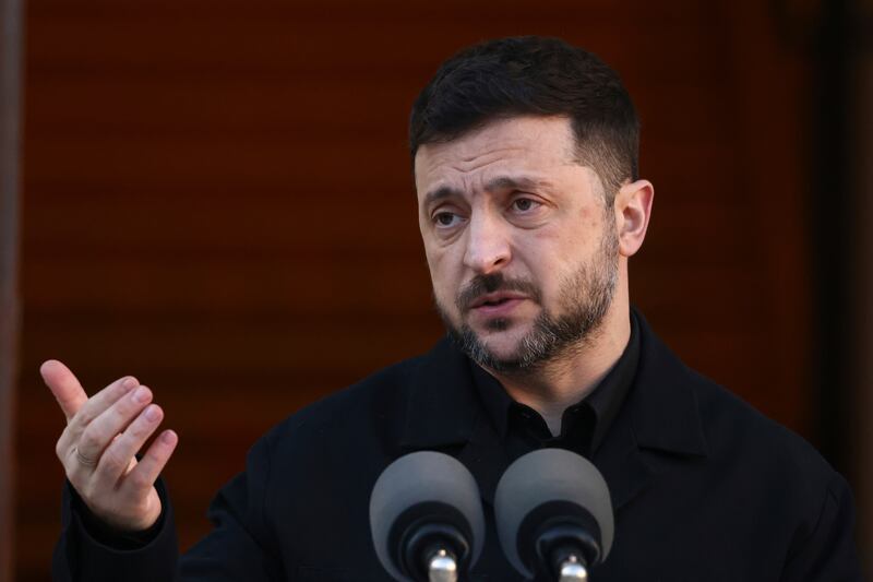 Ukraine President Volodymyr Zelenskyy gestures while speaking as he takes part in a joint news conference with the Irish Taoiseach Micheal Martin in Dublin, Ireland, Tuesday, Dec. 2, 2025. (AP Photo/Peter Morrison)