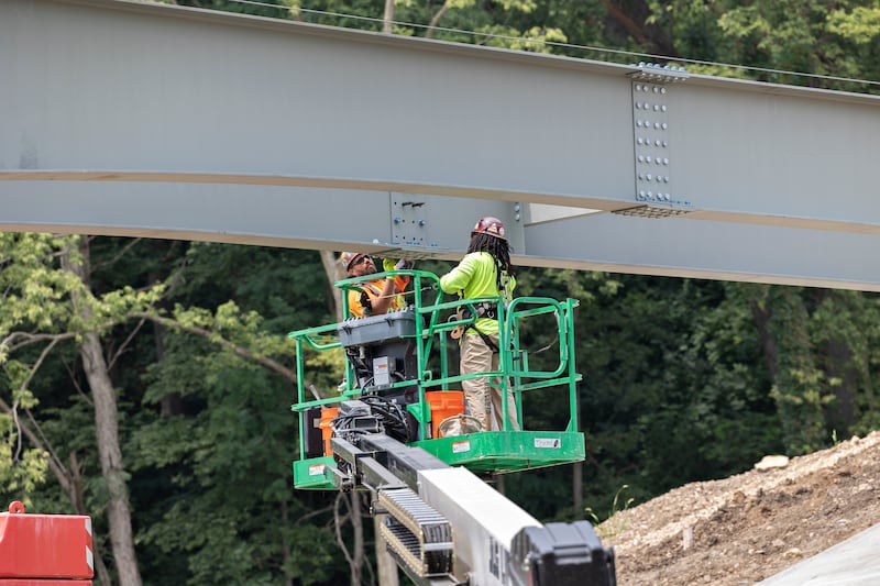 Workers join girders on the bridge Thursday, August 7, 2025, at Project Rock in Dixon.