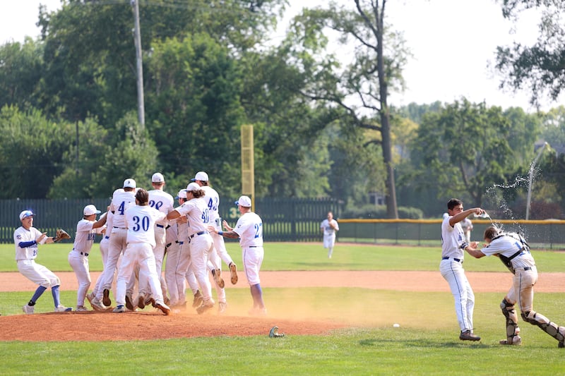 Members of the Beecher Muskies celebrate their National Amateur Baseball Federation World Series championship victory at North Central College in Naperville Sunday, August 3, 2025.