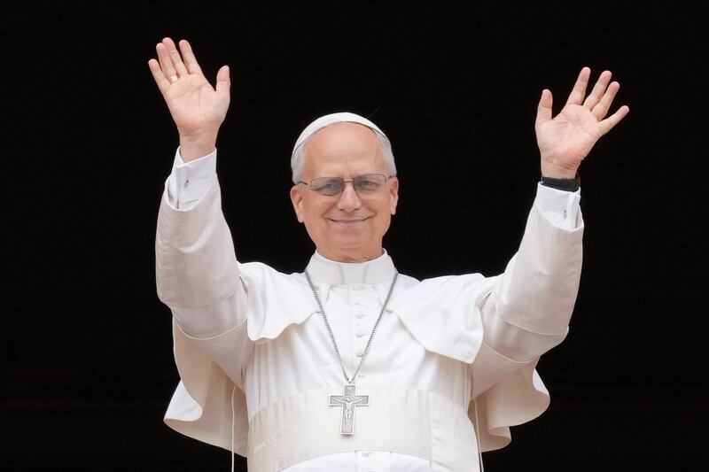 Pope Leo XIV appears at the central balcony of St. Peter's Basilica for his first Sunday blessing after his election, in St. Peter's Square at the Vatican, Sunday, May 11, 2025.(AP Photo/Gregorio Borgia)