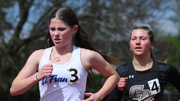 St. Francis, paced by distance wins, takes fourth at Schaumburg Invitational