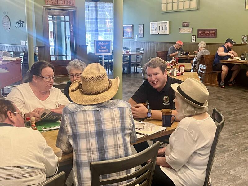 State Rep. Brad Fritts, R-Dixon, talks politics with local residents during a Coffee & Conversations event at Mary's Diner in Dixon.