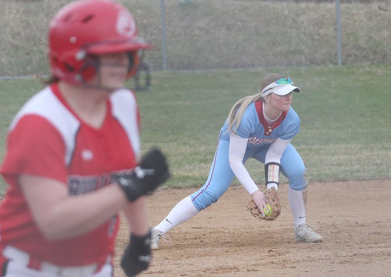 Ottawa's Piper Lewis fields a ground ball to throw to first base before Streator's Alexcia Middelton reaches home on Thursday, March 27, 2025 at Ottawa High School.