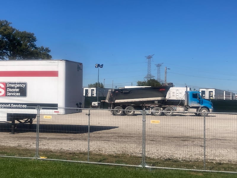 A dump truck prepares to dump gravel in the lot of the Army Reserve Training Center.
Thursday, Oct. 9, 2025.