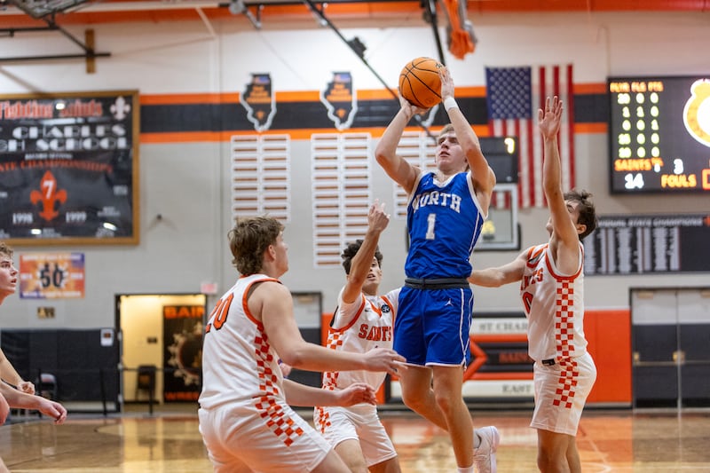 Wheaton North's Henry Schlickman hangs a jumper against St. Charles East on Saturday, Dec.13,2025 in St. Charles.