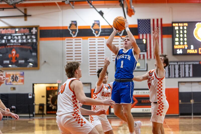 Wheaton North's Henry Schlickman hangs a jumper against St. Charles East on Saturday, Dec.13,2025 in St. Charles.