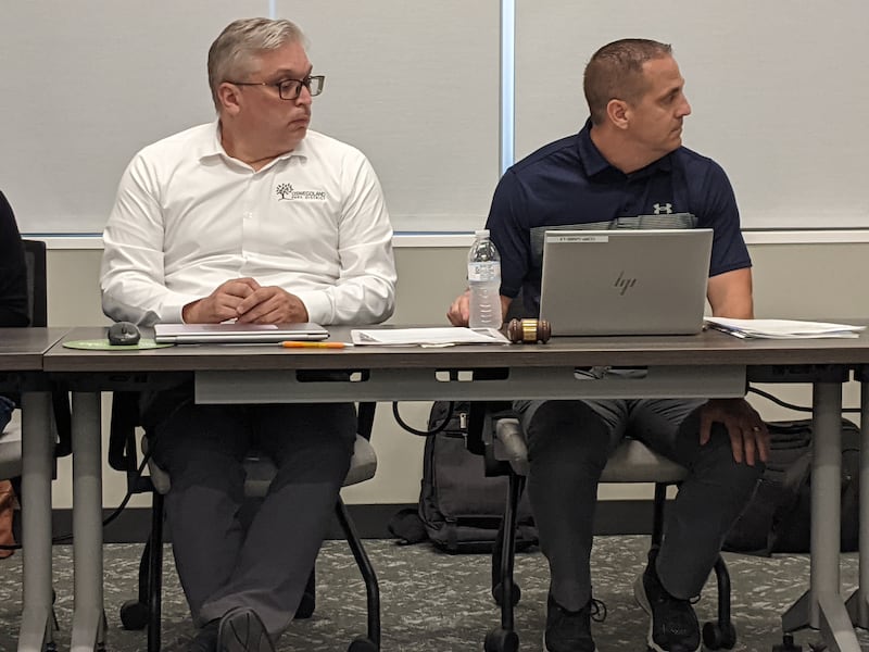 Oswegoland Park District Director of Parks & Planning Chad Feldotto, left, was appointed as the district’s deputy executive director at the July 17 Oswegoland Park Board meeting. To the right is Oswegoland Park Board Vice President Bob Ijams.