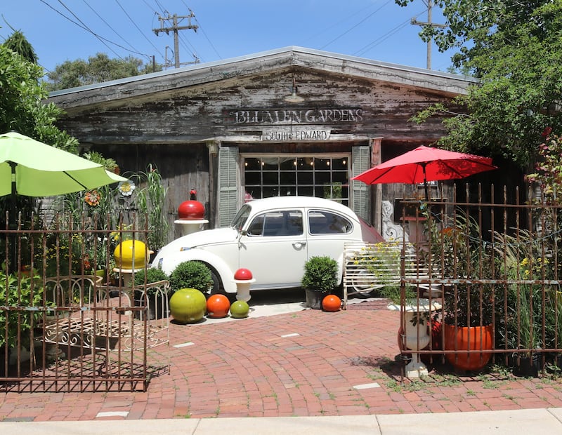 The outside area at Blumen Gardens is decorated with plants and artwork making every shopping trip to the facility a pleasant experience.