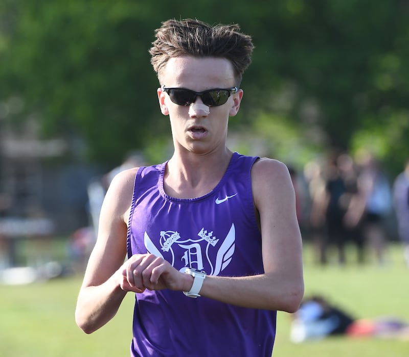 Dixon's Westin Conatser checks his watch for his time as he finishes first in the 3200 meters at the Big Northern Conference Meet at Stillman Valley on Thursday, May 14, 2026.