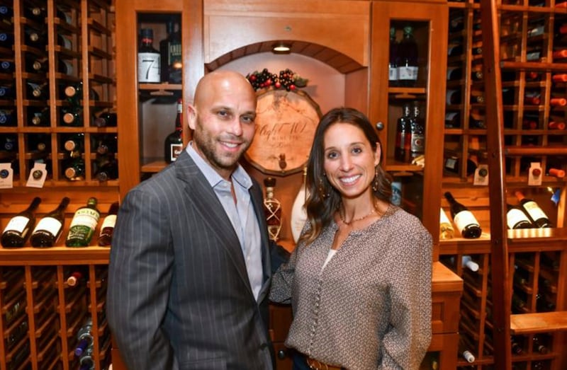 Ryan and Abby Magruder, of Bourbonnais, pose in the wine cellar at Flight 102 Wine Bar in Bourbonnais. The couple recently became the new owners of the Bourbonnais restaurant, opened in 2013 by Manteno residents Brian and Kelly St. Aubin.