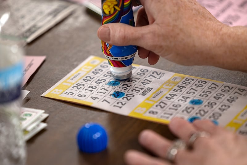A player marks her bingo card Thursday, Nov. 21, 2024.