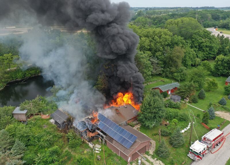 Firefighters respond to a fully-engulfed structure fire in the 500 block of North 2782nd Road on Monday, July 21, 2025 in La Salle. FIre departments from Utica, Wallace, Naplate, Spring Valley, Mendota, Troy Grove, La Salle, Peru, Oglesby and Tonica responded to the scene. Fire crews were dispatched at 9:45 a.m. La Salle Police and La Salle County Sheriff were also on the scene.
