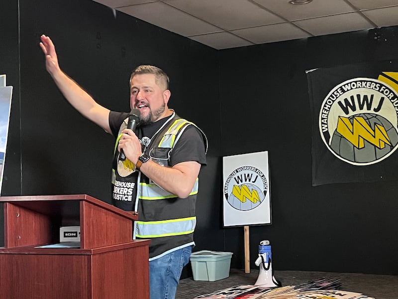 Marcos Ceniceros, executive director of Warehouse Workers For Justice, speaks to a crowd for an event recognizing International Workers' Day on Friday, May 1, 2026, in Joliet.