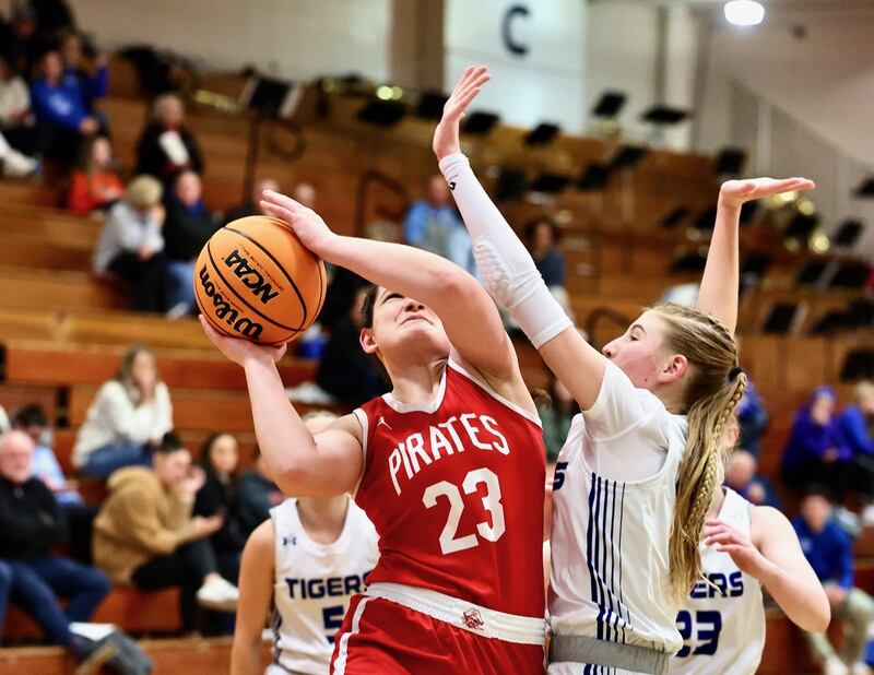 Ottawa's Mary Stisser shoots over Princeton's Payton Brandt Tuesday night at Prouty Gym. The Pirates won 44-40.