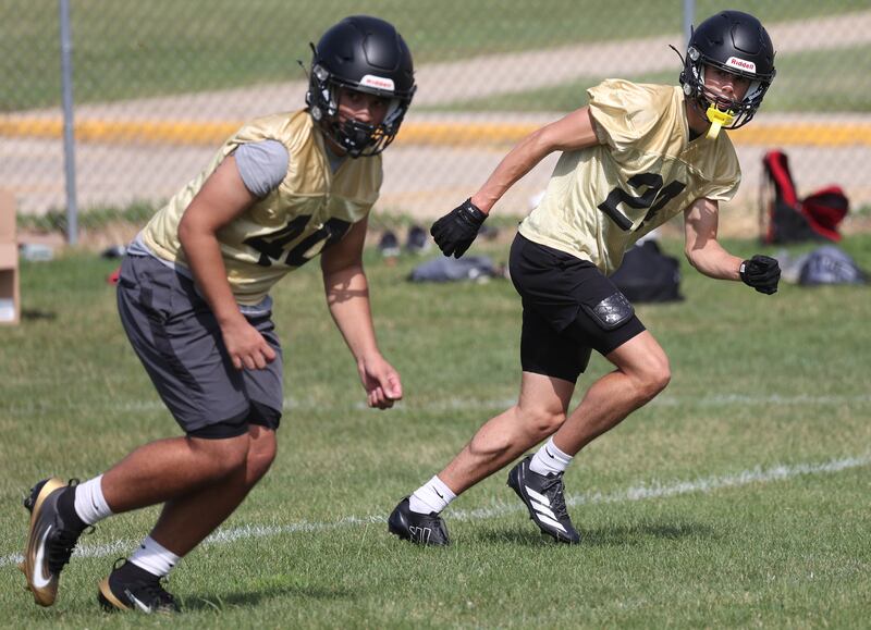 Sycamore’s Crewe Bartelt (right) works on special teams Monday, Aug. 11, 2025, during their first fall practice at the school.
