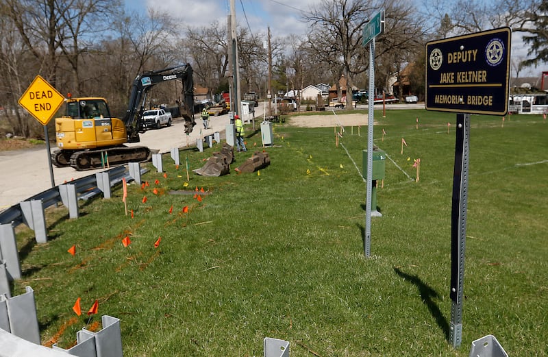 Workers for the Nunda Township highway department, remove a guard rail on Tuesday, April 15, 2025, as they begin to install a parking lot and park. Mike Lesperance, the outgoing Nunda Township Highway Commissioner, is build a park and parking lot next to a township bridge over the Fox river on Rawson Bridge Road in Cary.