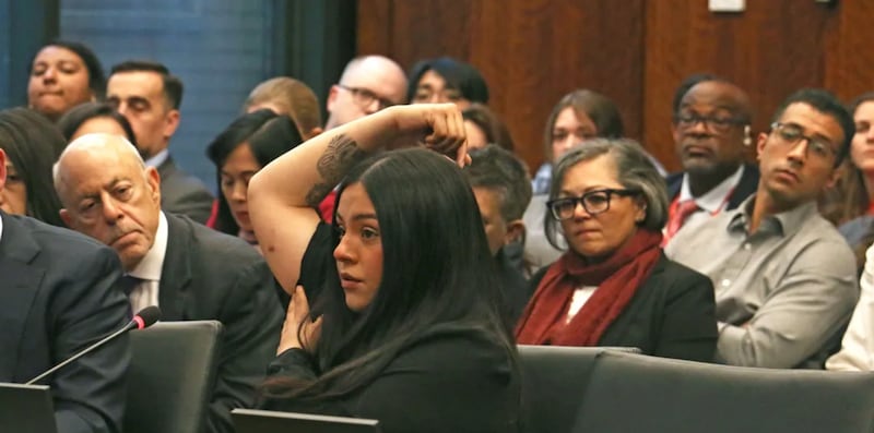 Marimar Martinez testifies at an April 28, 2026 hearing of the Illinois Accountability Commission, showing one of the seven holes left in her body after she was shot by a Border Patrol agent in October.