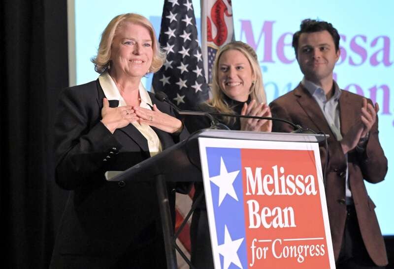 Melissa Bean reacts to her Democratic primary win Tuesday night, March 17, 2026, at her election party at the Hyatt Regency in Schaumburg. At right is her daughter Michelle and son-in-law Brian McGregor.