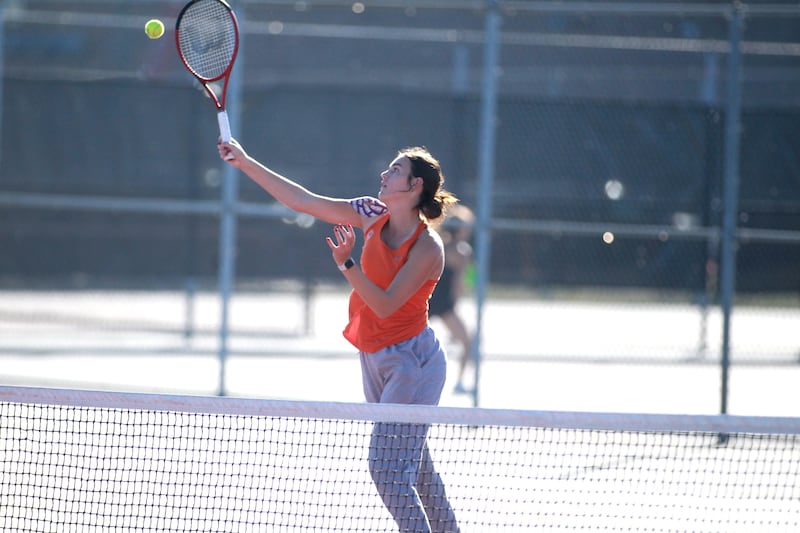 Savannah Millard of Oswego returns the ball during a match against Jenna Labriola of Lincoln-Way Central in the IHSA 2A singles tennis championship at Schaumburg High School.