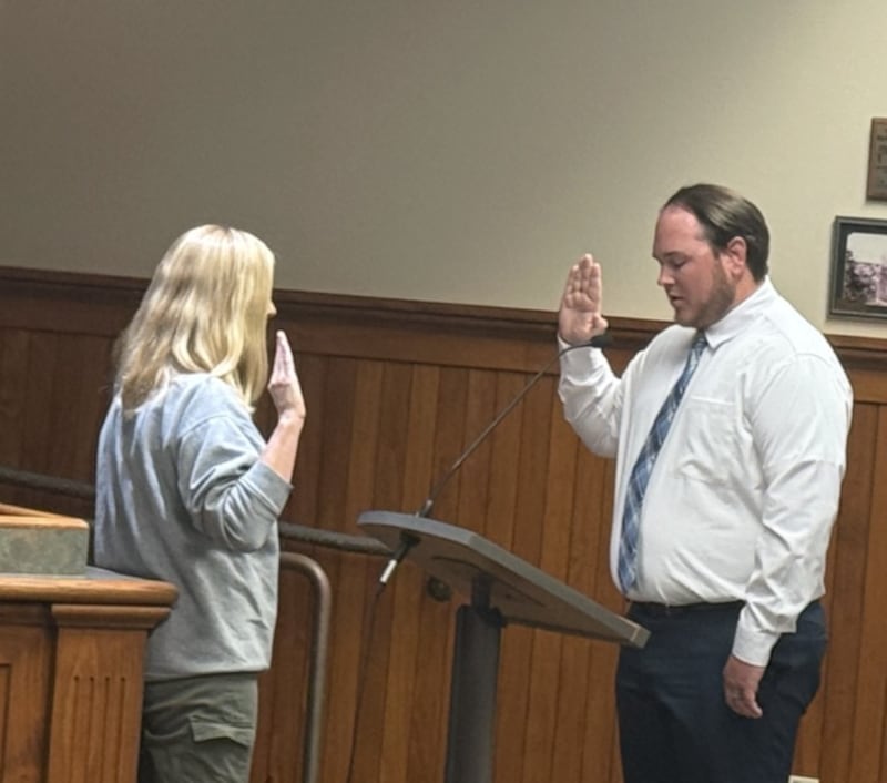 Kyle Henson getting sworn in as the newest member of the Ottawa Police Department at the April 7 meeting of the Ottawa City Council.