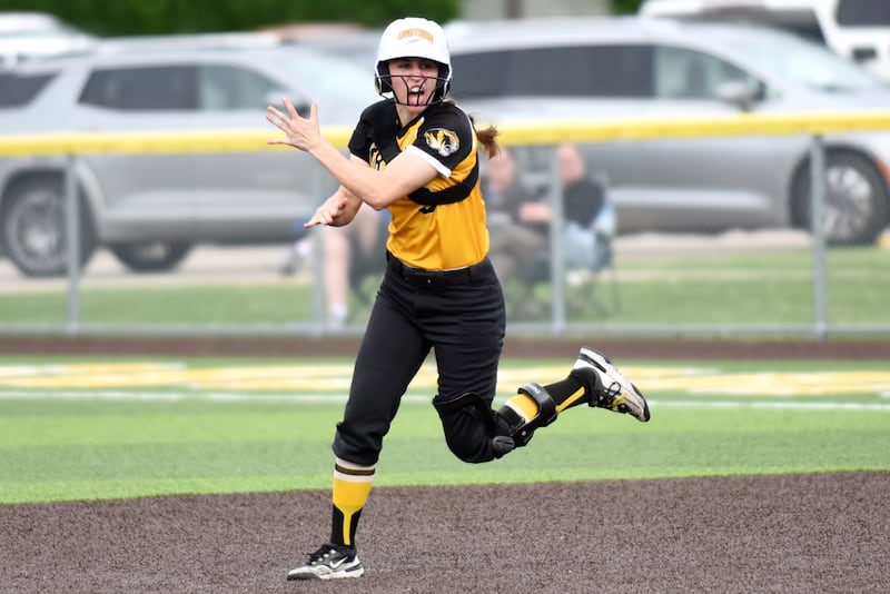 Herscher's Keira Ahramovich joyously rounds the bases following her go-ahead home run in the sixth inning of a Class 2A Manteno Regional quarterfinal game against Peotone at Herscher Monday, May 18, 2026.