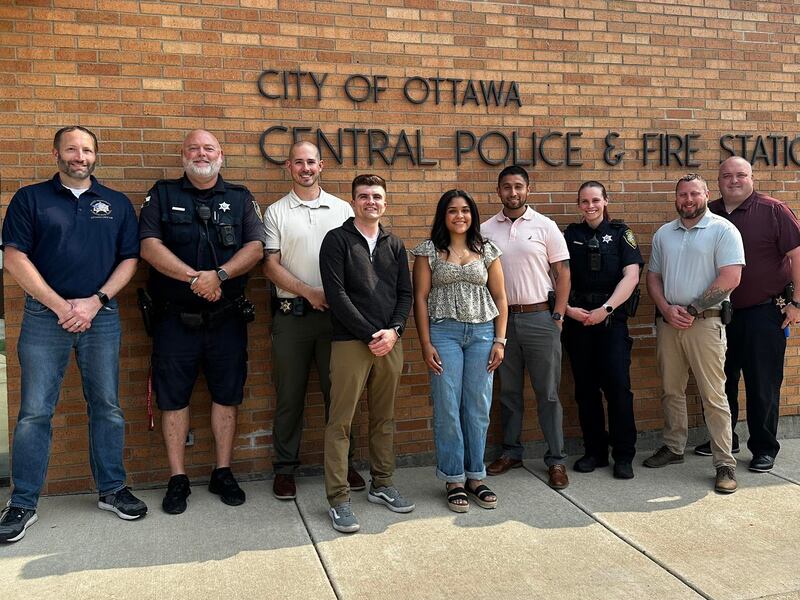 Ayana Miller (front right) posed for a photo with Brady Sember (front left) and members of the Ottawa Police Benevolent and Protective Association after being named the 2025 Officer Brian Sember Memorial Scholarship recipient.