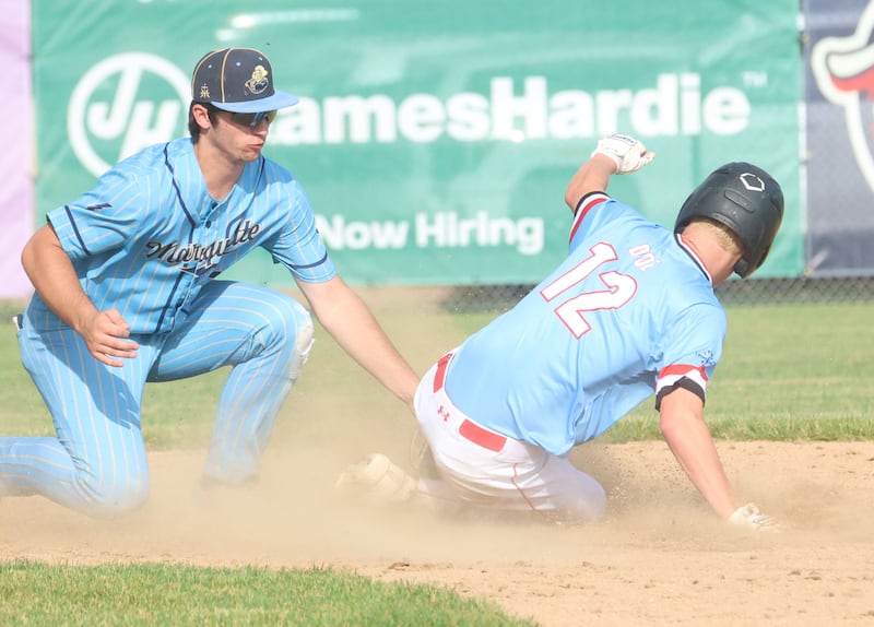 Marquette's Alec Novotney puts a tag on Brimfield's Connor Doe during the Class 2A Supersectional game on Tuesday, June 9, 2026 at Schweickert Stadium in Peru.
