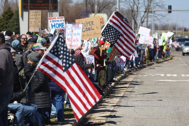 Hundreds of people line Plainfield Road at the No Kings rally on Saturday, March 28, 2026 in Joliet.