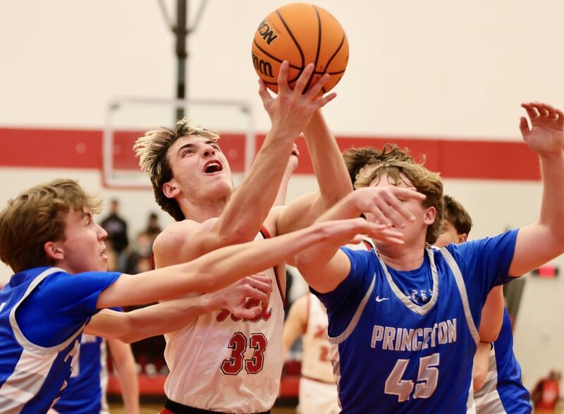 Hall's Braden Curran shoots between Princeton's Jackson Mason (left) and Luke Smith at the Colmone Classic on Friday night.