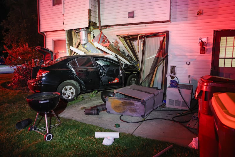 A car crashed into a townhouse in Woodstock at about 2:30 a.m. on May 30, 2026, while a family of four slept inside.