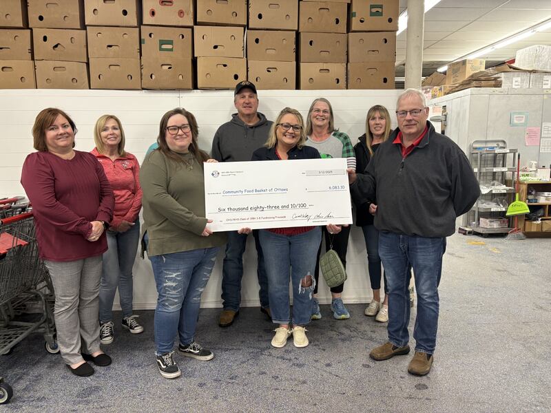 The Ottawa/Marquette High School '84 class donated over $6 thousand to Community Food Basket of Ottawa. Pictured from left: Sue Saar, Jessica Haywood, Marissa Vicich (Ottawa Food Basket Director), Julie Wheatland, Rich Phelps, Carol Kuzmich, Kim Michelini, Kathi Johnson, Chris Saar.
