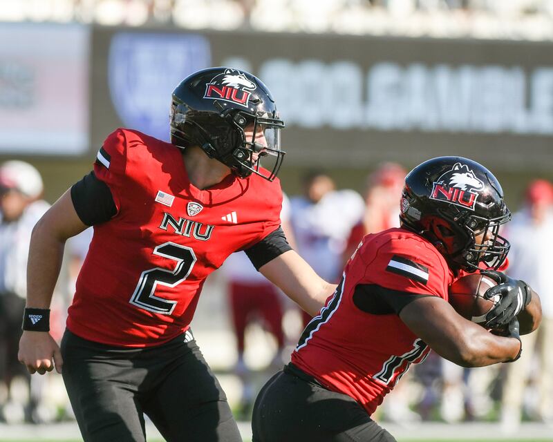 Northern Illinois University's quarterback Brady Davidson (2) hands the ball off to running back teammate Chavon Wright (10) during the game on Saturday Oct. 4, 2025, while taking on Miami of Ohio held at Huskie Stadium in DeKalb.