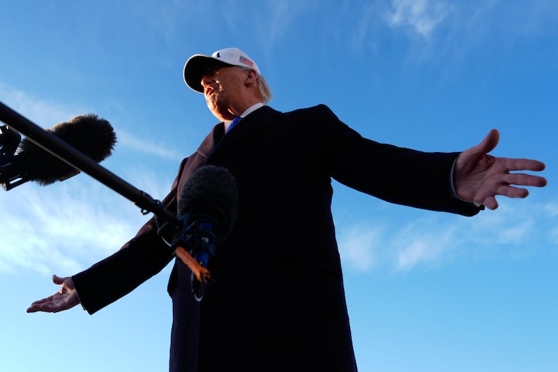 President Donald Trump speaks to reporters before he boards Air Force One, Friday, March 13, 2026, at Joint Base Andrews, Md., for a trip to Florida. (AP Photo/Mark Schiefelbein)