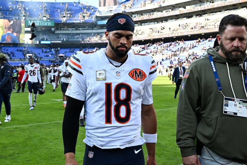 Chicago Bears quarterback Caleb Williams (18) walks off the field after an NFL football game against the Baltimore Ravens, Sunday, Oct. 26, 2025, in Baltimore. (AP Photo/Terrance Williams)