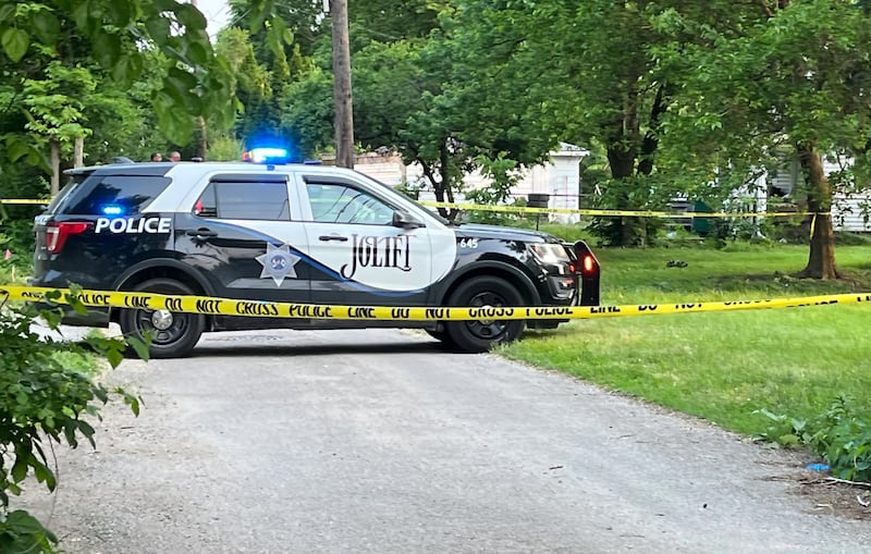 A Joliet Police Department squad vehicle posted in a blocked-off alley on Monday, June 2, 2025, where Manuel Mejia Perez, 13, of Joliet, was found dead with gunshot wounds.
