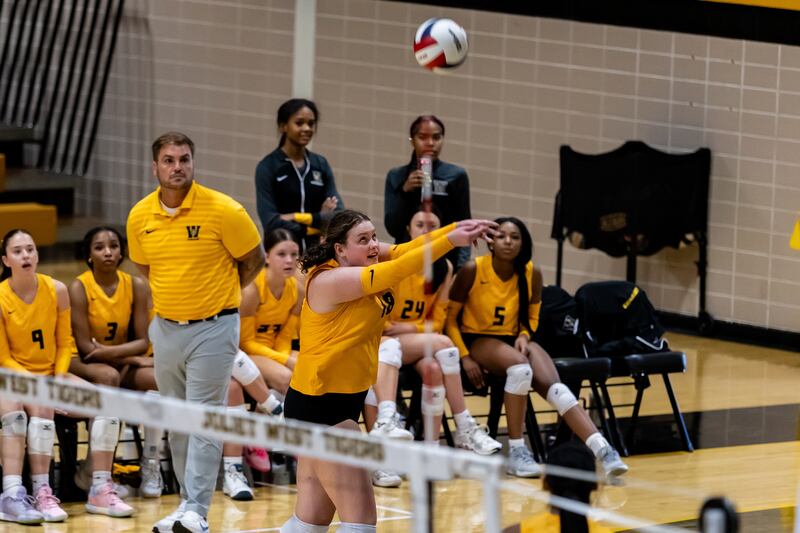 Joliet West's Penny Wagner makes a defensive play against Lincoln-Way East during a Varsity Volleyball match at Joliet West on Aug. 26, 2025.