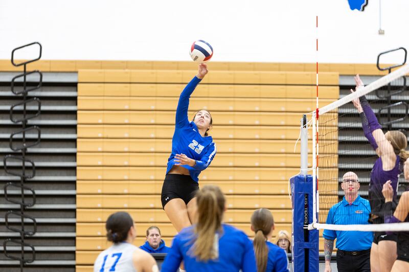 St. Charles North's Haley Burgdorf hits a kill shot against Downer's Grove North on Thursday Oct. 23, 2025 in St. Charles.