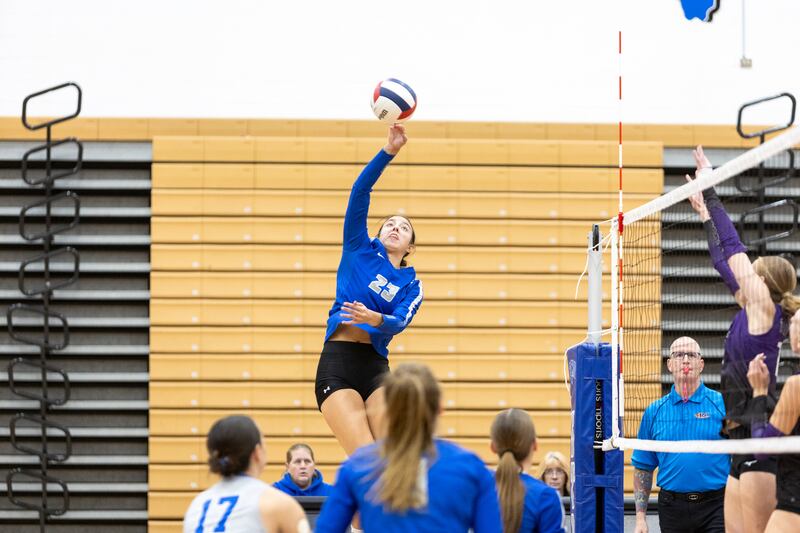 St. Charles North's Haley Burgdorf hits a kill shot against Downer's Grove North on Thursday Oct. 23, 2025 in St. Charles.