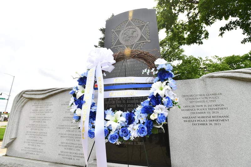 A wreath is laid at the base of the Kankakee County fallen officers memorial wall where 17 names are engraved at the annual Law Enforcement Officers Memorial Ceremony at the Kankakee County Courthouse in 2024.