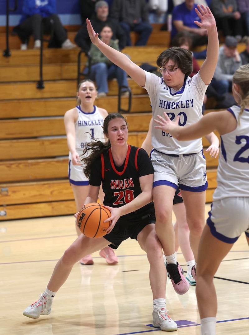 Indian Creek's Elsie Betz tries to get a shot up against Hinckley-Big Rock's Grace Hall during their game Thursday, Jan. 29, 2026, at Hinckley-Big Rock High School.