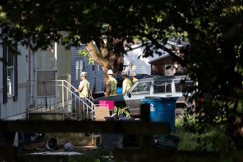 NICOR employees work in the area after a house explosion Monday, June 22, 2026, in Dixon.