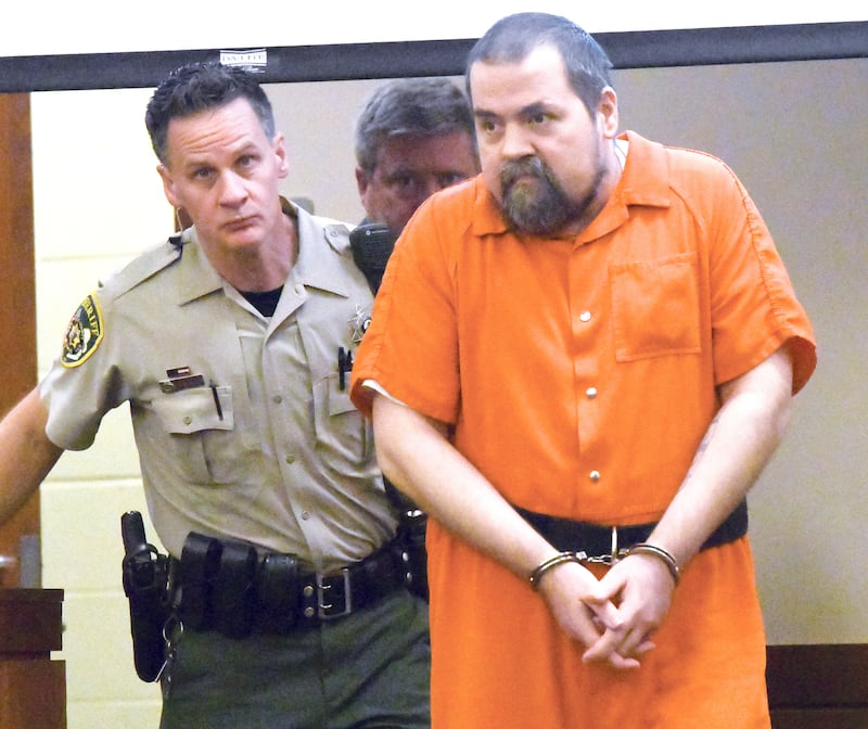 Derek Swanlund is escorted into a courtoom at the Ogle County Judicial Center on Wednesday, Oct. 29, 2025 by Deputy Dan Daub (left) and his attorney Assistant Ogle County Public Defender Eric Morrow (center) or a pretrial hearing. Swanlund is charged with shooting and killing Cameron Palsy.