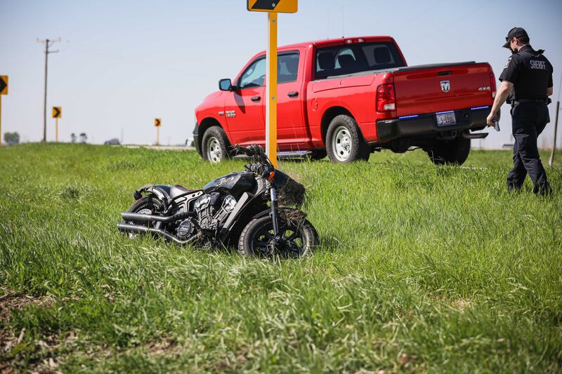 First responders work the scene of a motorcycle crash near Marengo on Saturday, May 10, 2025. Officials reported days later that the 19-year-old motorcyclist died from his injuries.