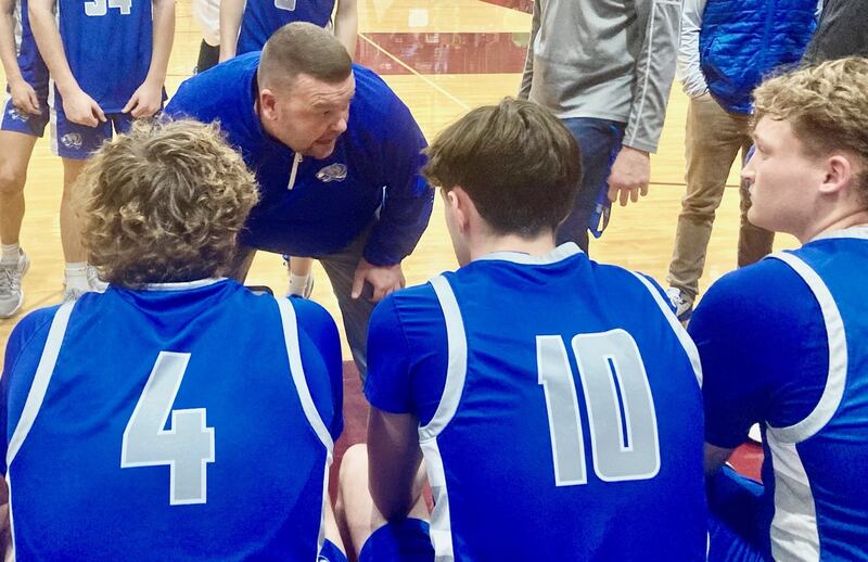 Princeton coach Jason Smith works the Tiger bench during a timeout in Friday's sectional championship game at Marengo.