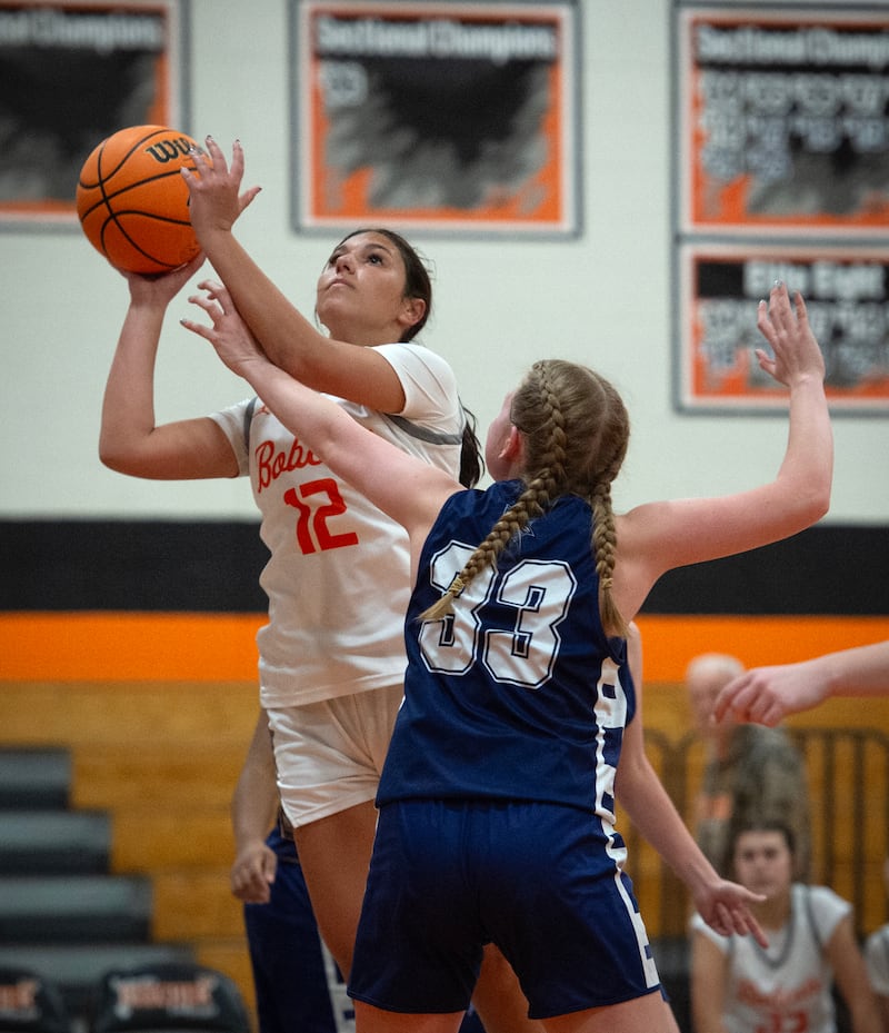 Beecher's Gianna Bonomo, left, takes a shot as Grace Christian's Analiese Jorgensen guards in a game on Monday, January 5, 2026.